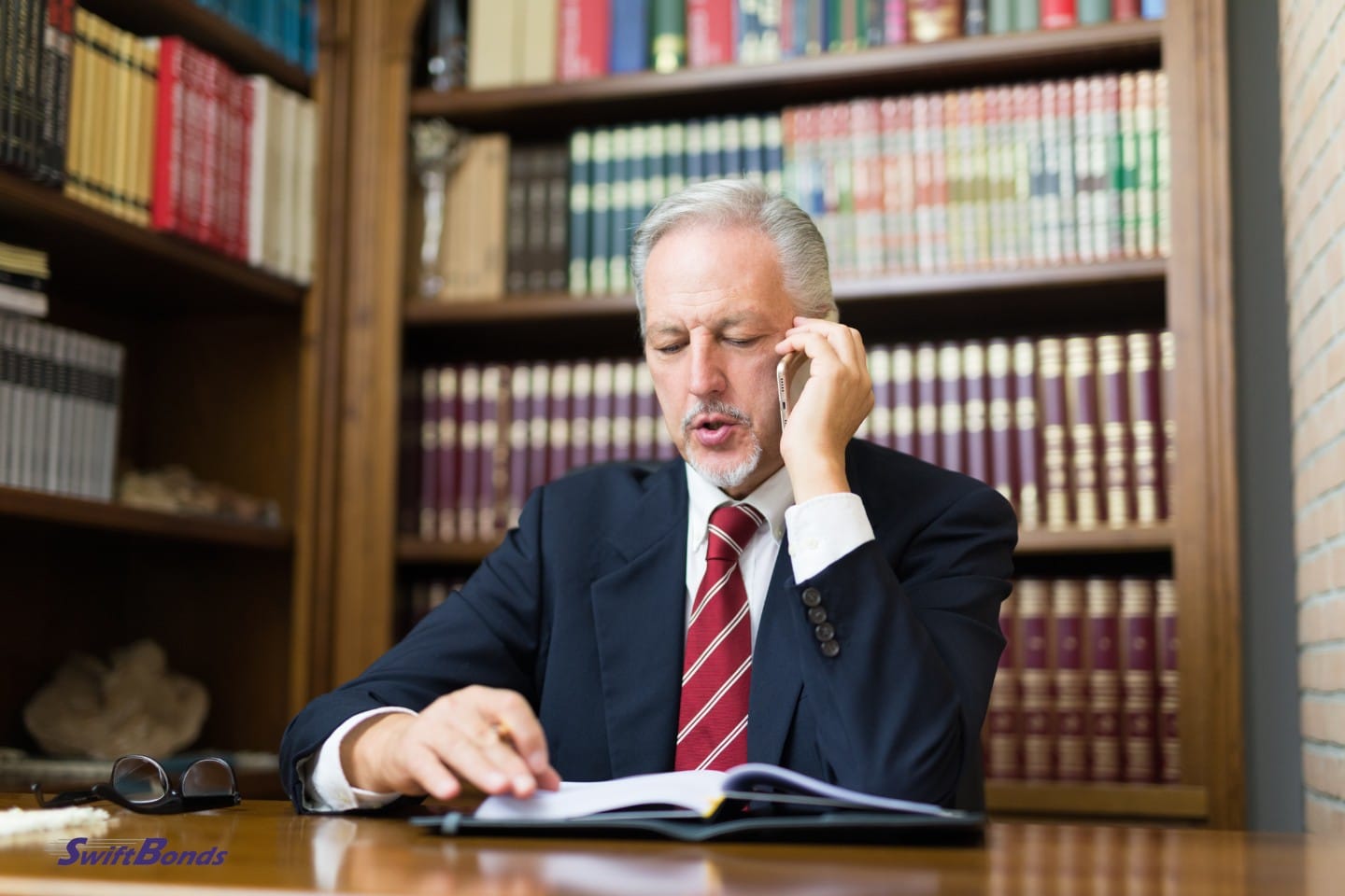 A lawyer is discussing surety bonds with his client.